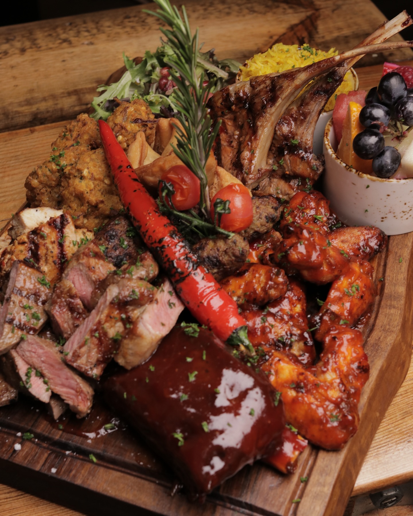 Mixed grill with tomahawk and wings