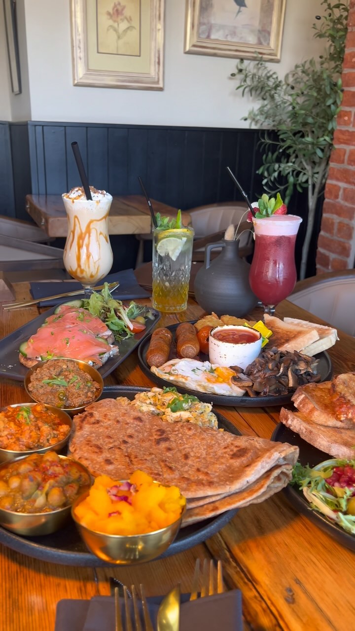 Curry breakfast spread with parathas