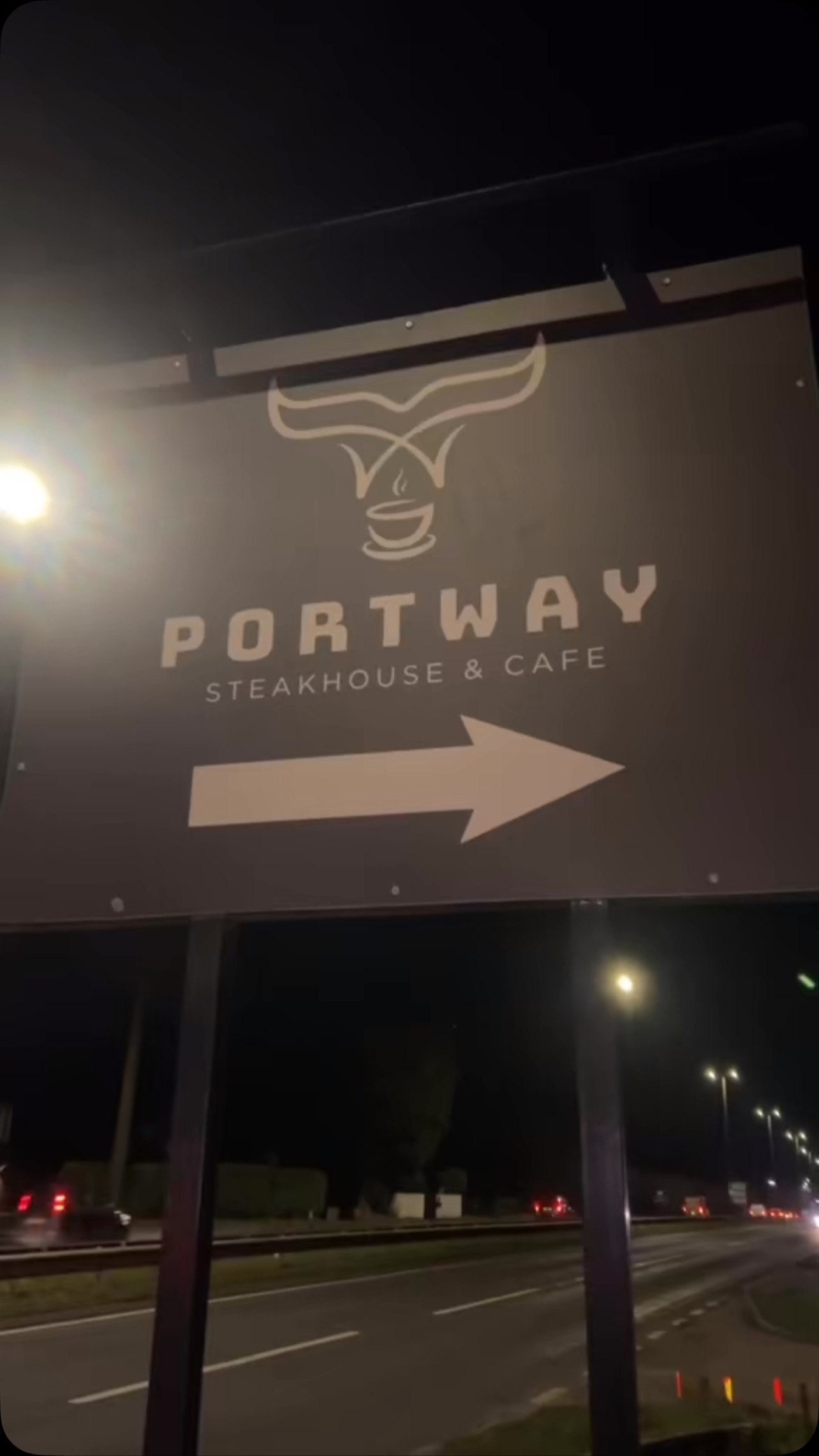 Portway sign glowing at night