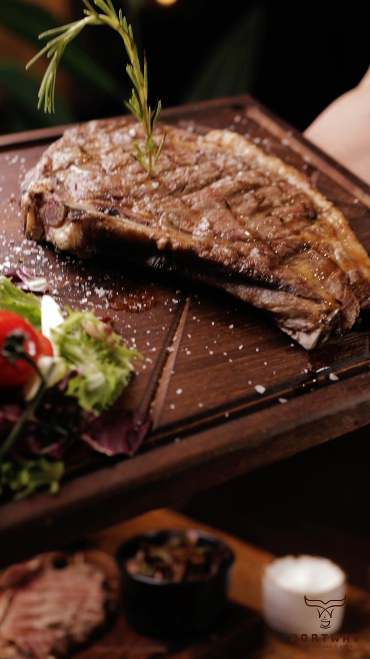 Char-grilled steak on the dark board